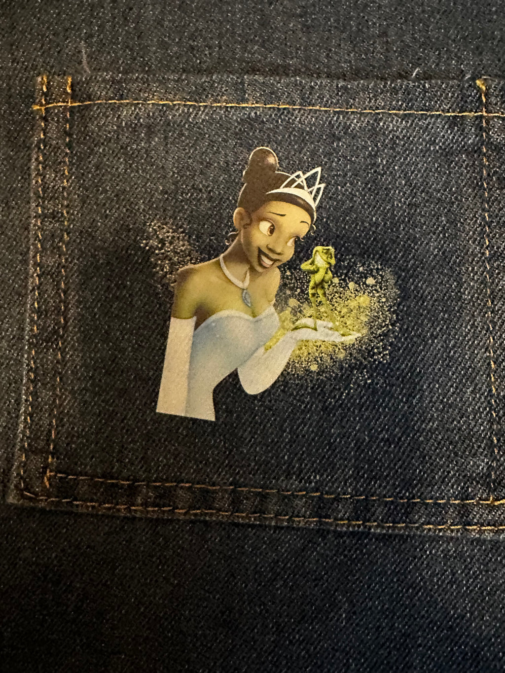 Illustration of a fairy on denim fabric