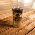 Tumbler with Jack Daniel's Tennessee Honey logo on a wooden surface